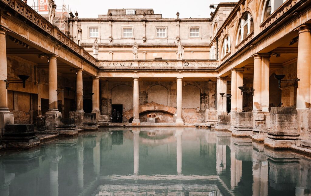 The steaming historic pool at the Roman Baths on one of the best day trips from London.